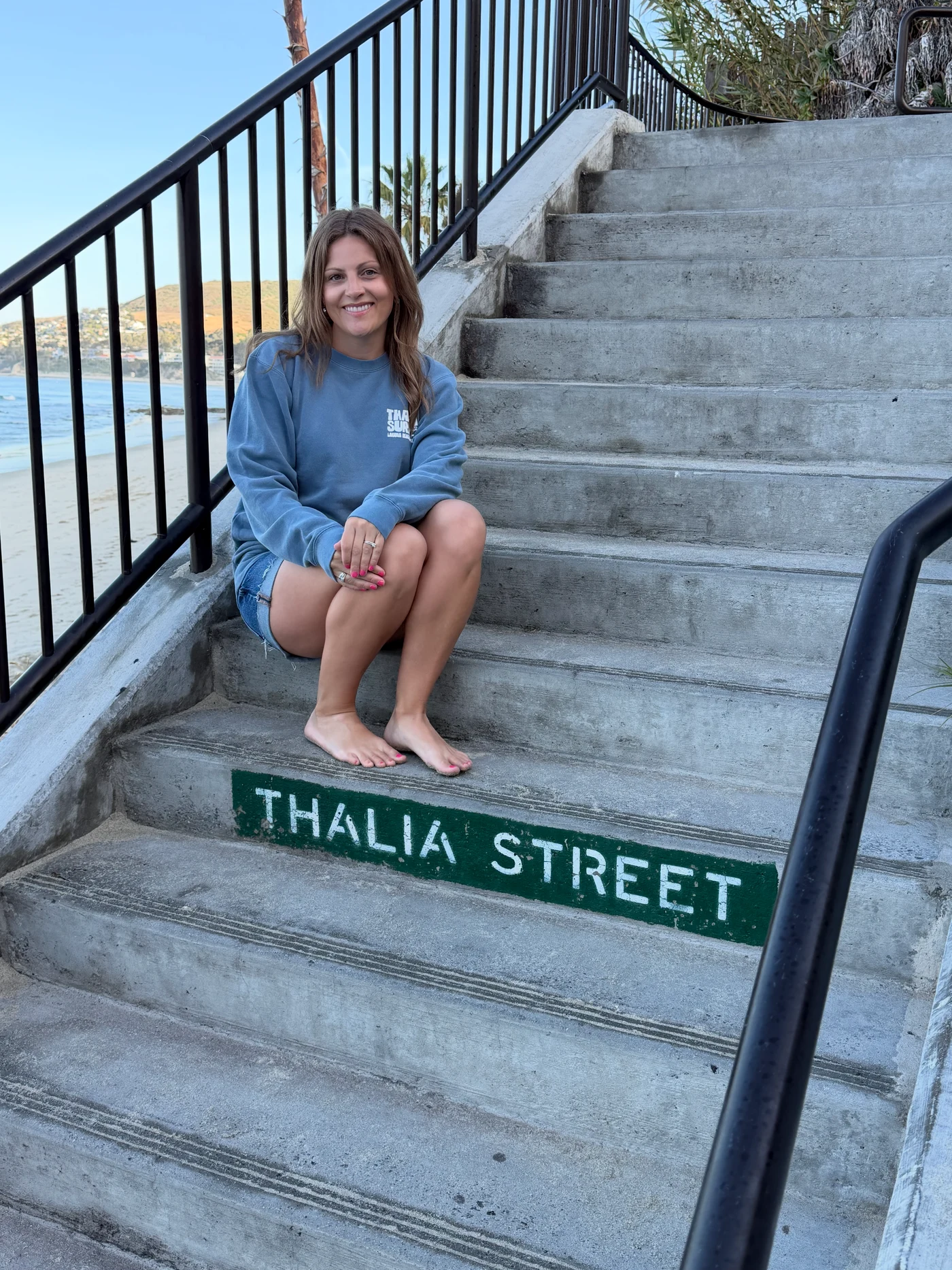 Erica Stoltz sitting on the Thalia Street steps